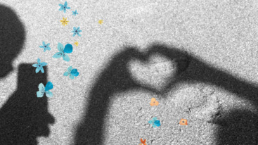 schaduw van twee handen die een hartje vormen