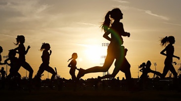 Runners compete in a 5k at sunset in Corona, California.
