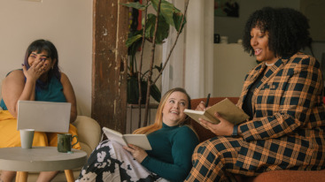 Female colleagues laughing together